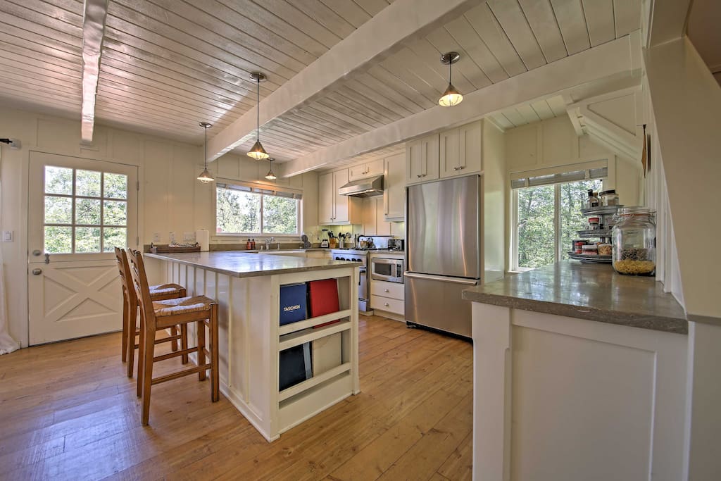 Inside, wood floors are beautifully contrasted with white walls and ceilings.