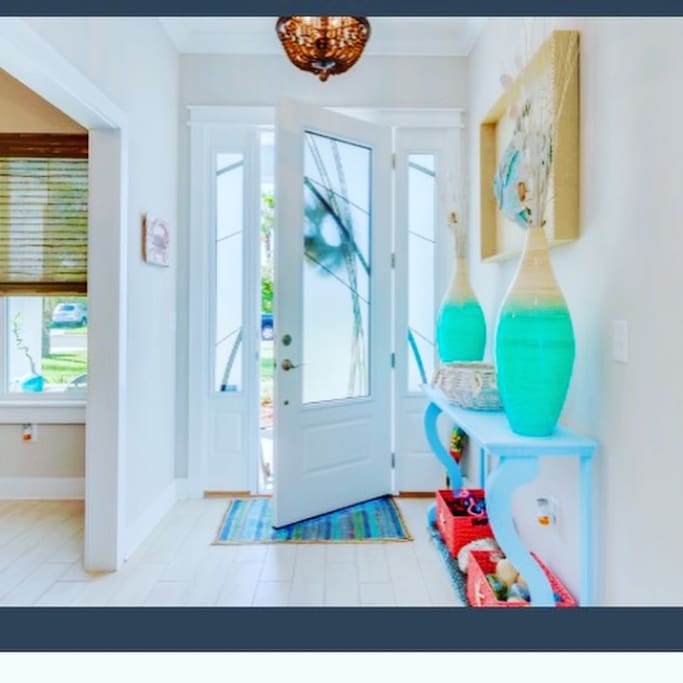Entrance into foyer sets the stage for beach colors and all things sand & surf!