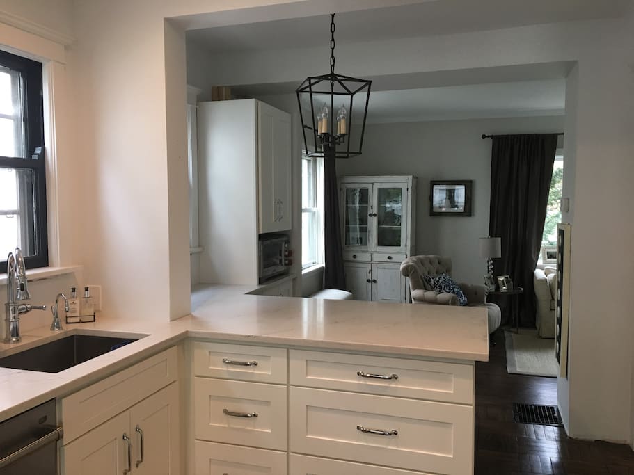 Well stocked, brand new kitchen with 3 bar stools on the peninsula.