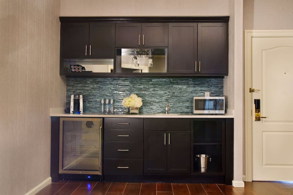 Kitchenette: microwave, fridge, Keurig coffee machine, glassware & flatware