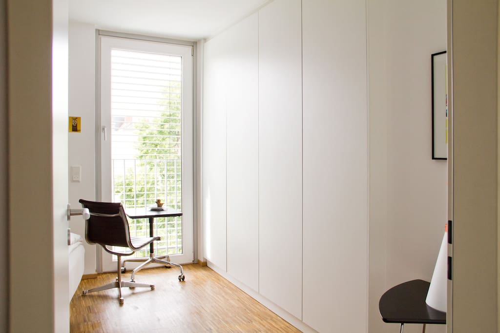 Your guestroom: A small Eames desk and chair for working at your laptop, while overlooking the beautiful urban backyard.
