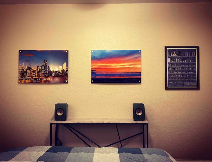 Hi-fi stereo in bedroom with queen bed