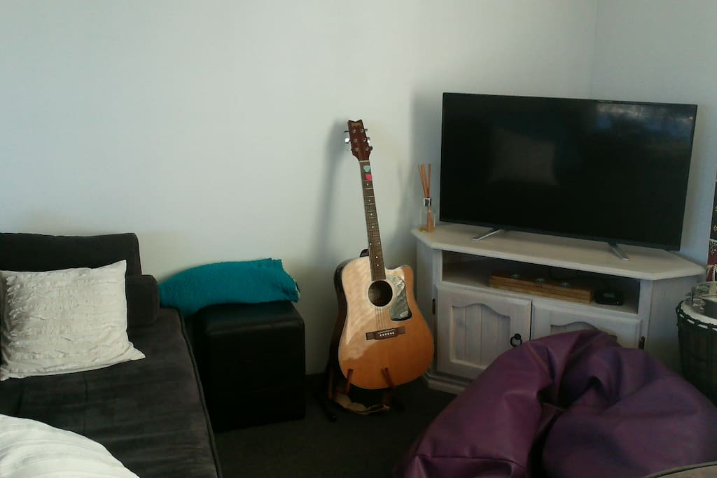 Living room. Jam on the guitar, or netflix? Your choice.