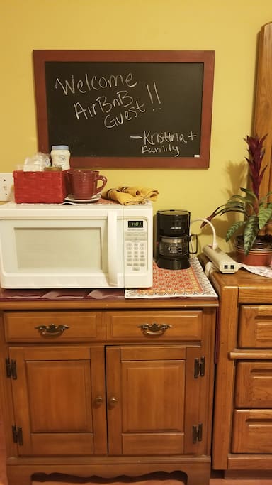 Coffee station with microwave and extension cord for multiple phone charging, etc.