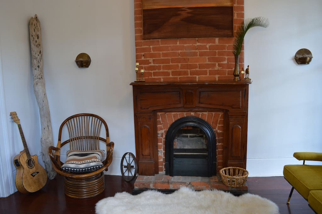 Old world charm off the warm brick and mahogany mantel and fireplace. A staple of New Orleans homes.