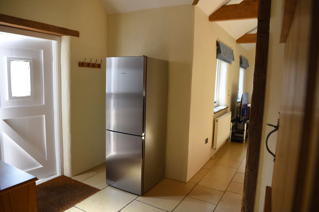Entrance with large fridge freezer