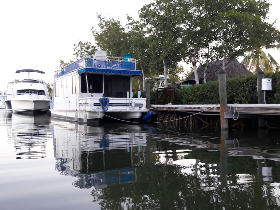 Houseboat from the water tiki hut to the side.