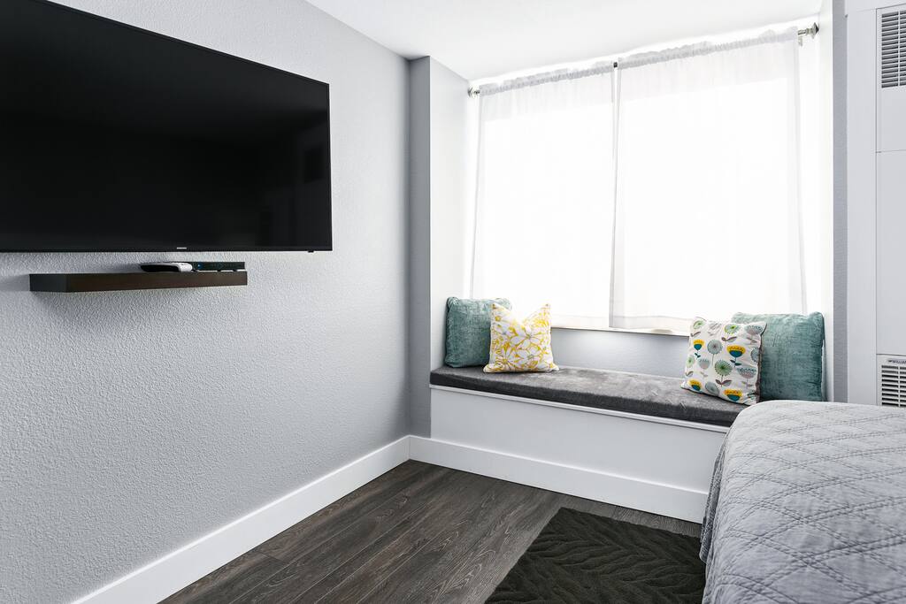 55 inch Samsung TV with cozy window seat