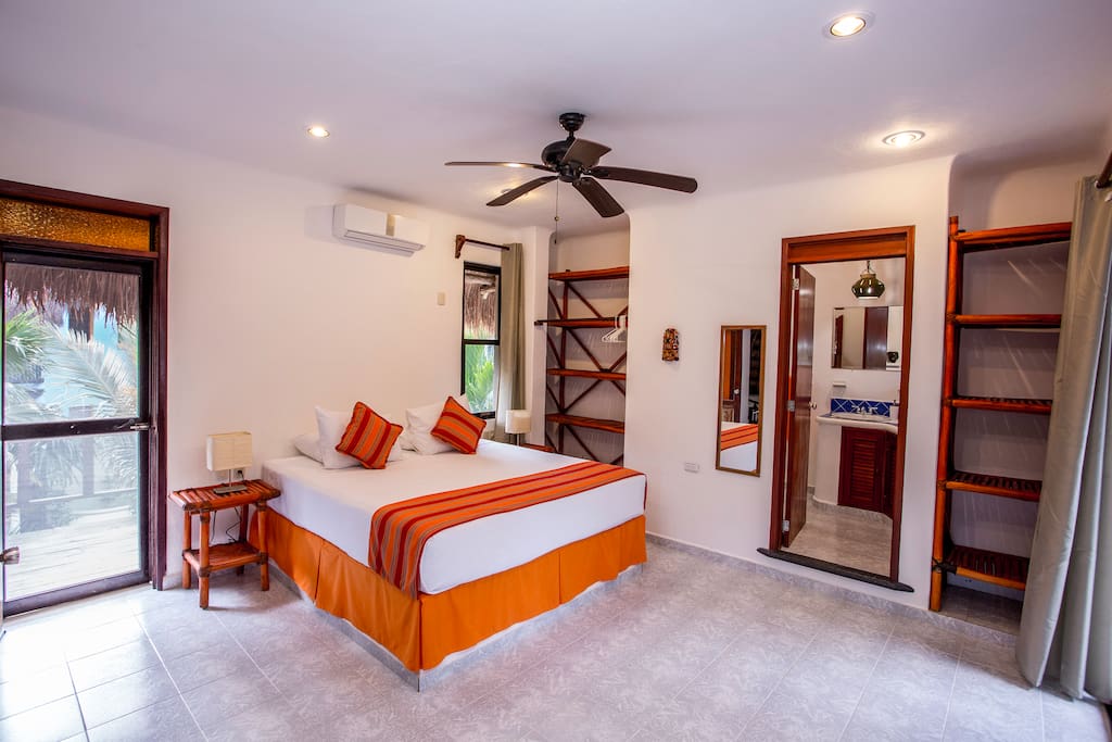 The upstairs bedroom has private bathroom and balconies on both sides