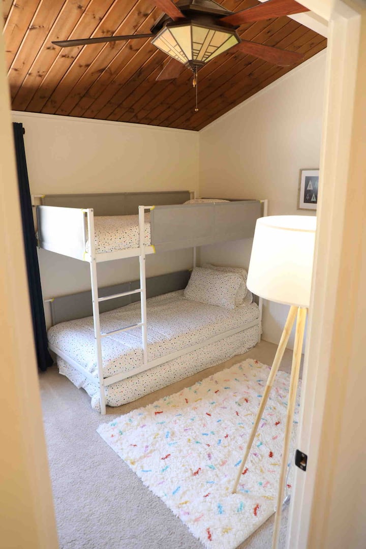 Full set of bunk beds, plus a trundle bed underneath to sleep three comfortably 