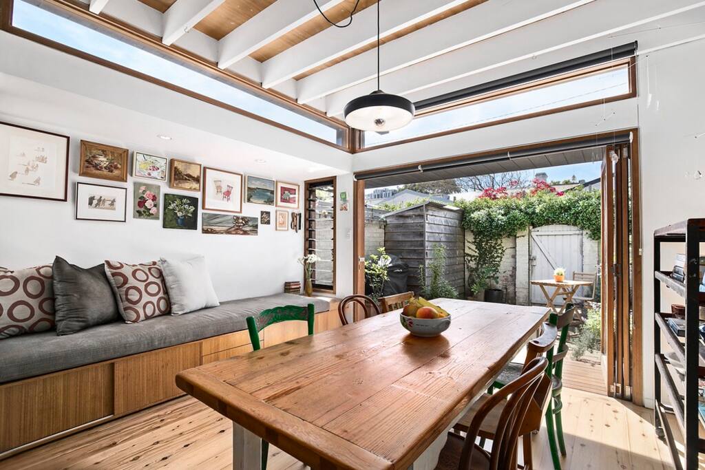 Sunny dining area opens up to rear courtyard