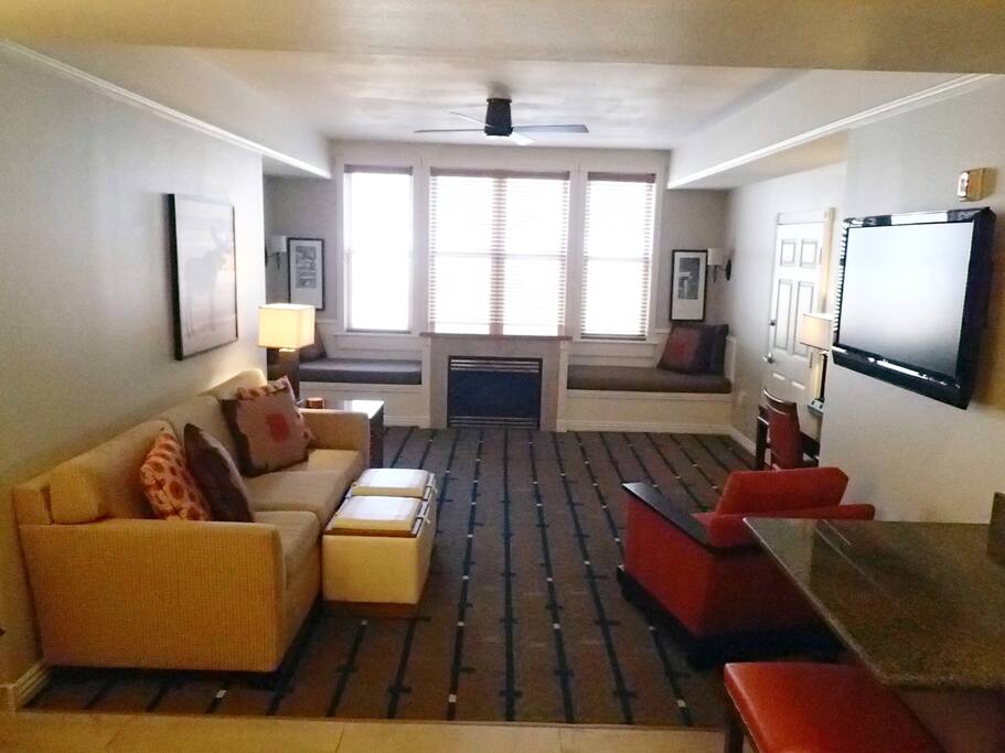 main living area off kitchen with fireplace