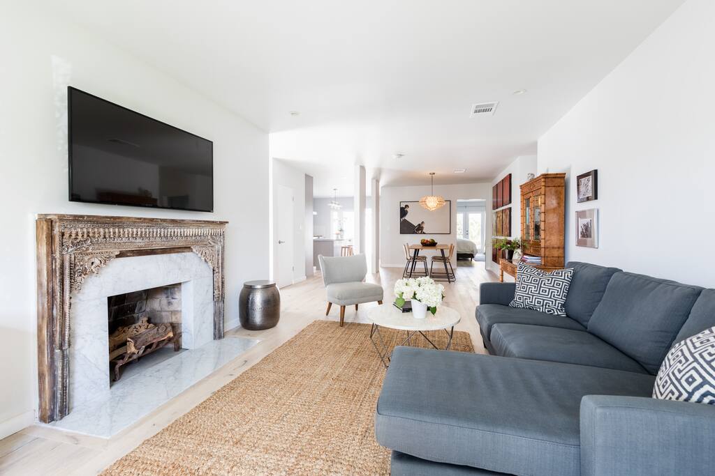 View of large newly designed open space living room, kitchen and dining room.
