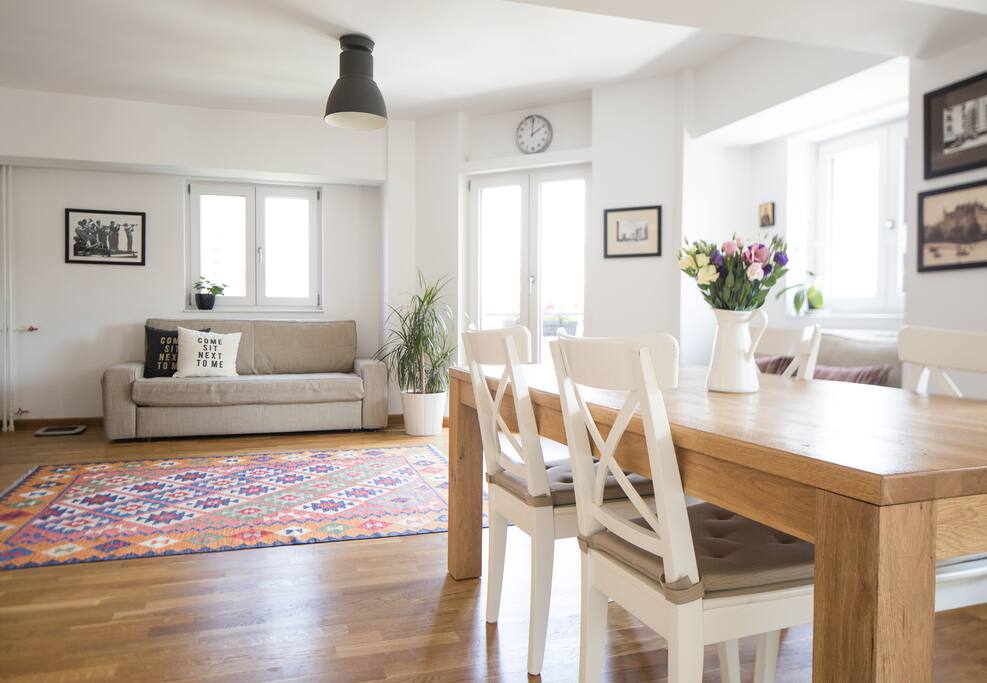 Spacious living room with access to two balconies.