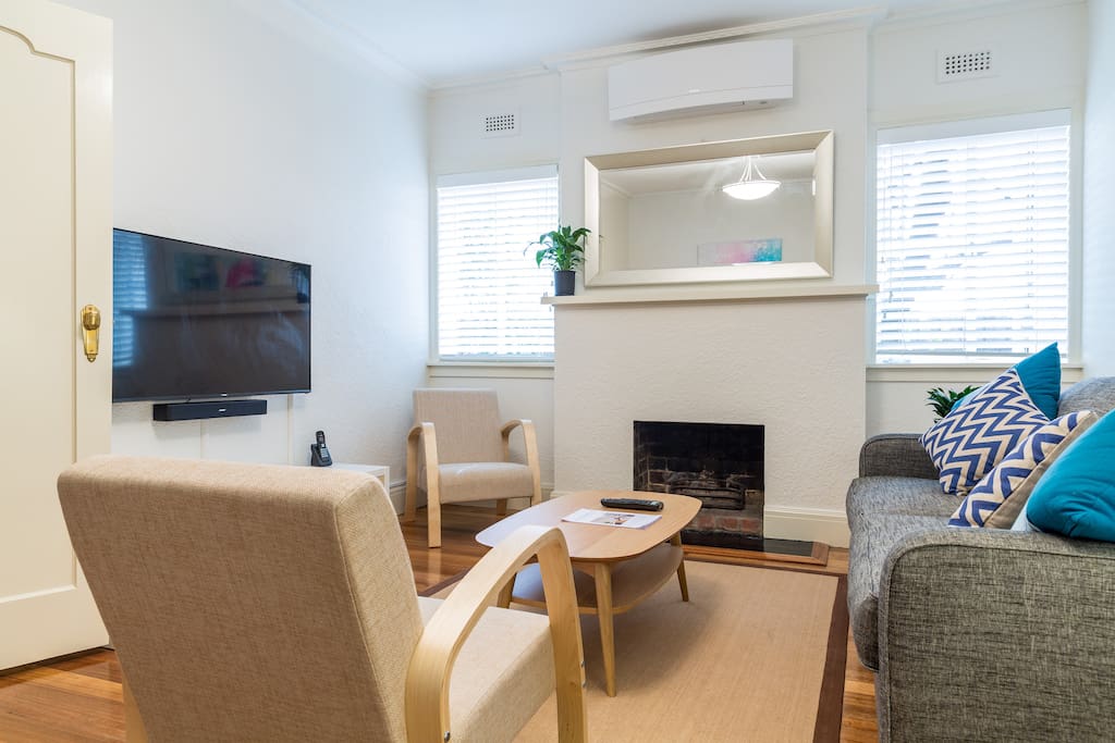Living room - Large TV, Bose soundbar, Apple TV, air-conditioning