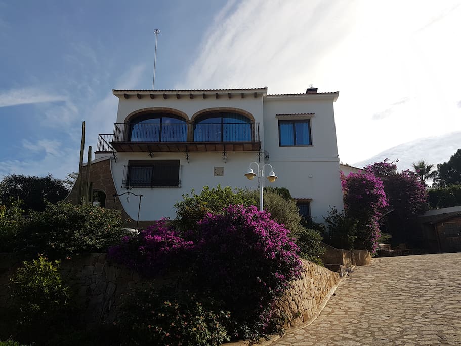 View of the villa from the Western Lower garden. All large windows and balconies are North- and West-orientated.