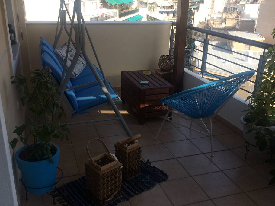The balcony! A happy place with plants and lanterns to enjoy the view!