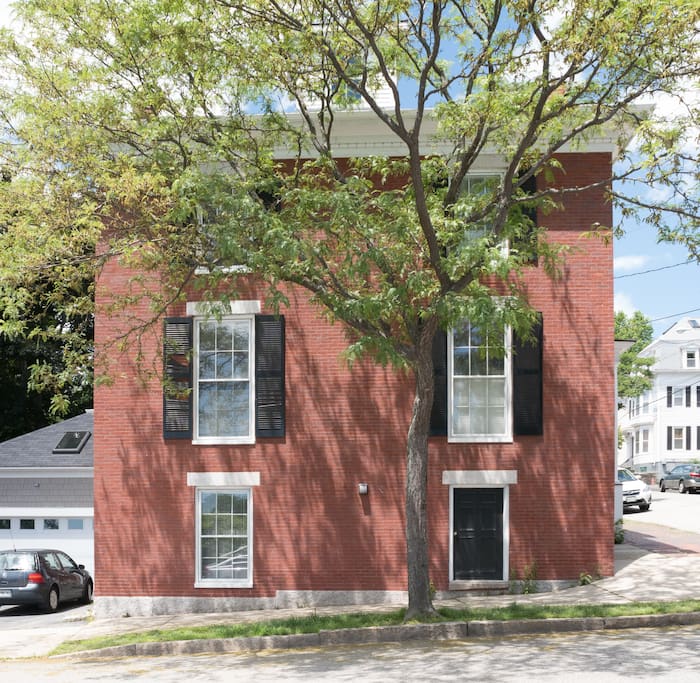 View of the house from Fore Street. The space where the car is parked is your spot during your stay.