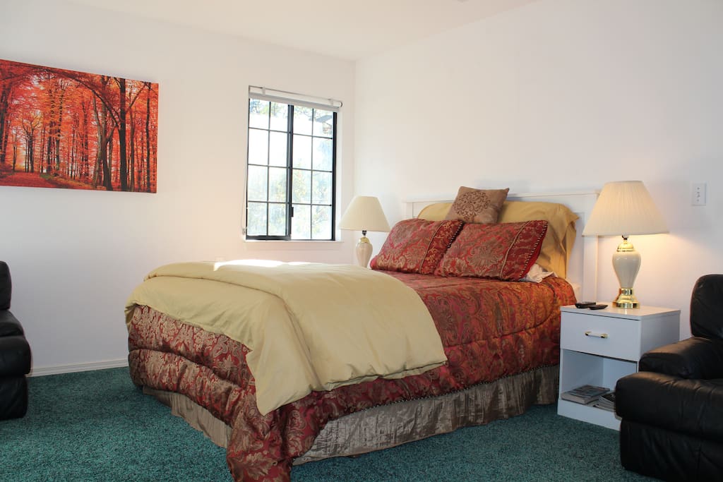 Posture Pedic queen bed with Egyptian cotton sheets and extra pillows for additional luxury