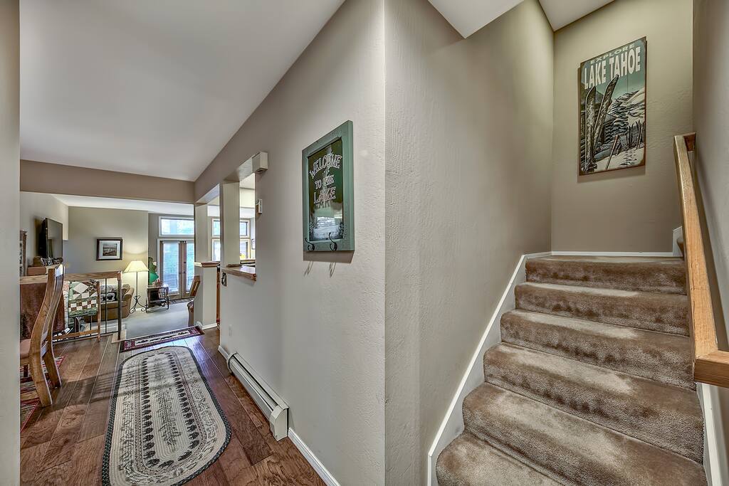 View from the entry-to the left is the dining, kitchen and living space. Travel up the stairs to the king master bedroom
