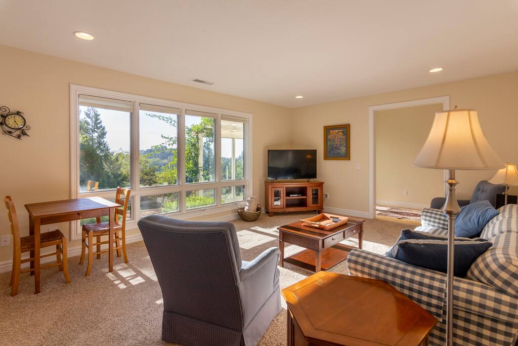 Living room includes a gas fireplace, game table, and LCD television for watching your favorite shows.