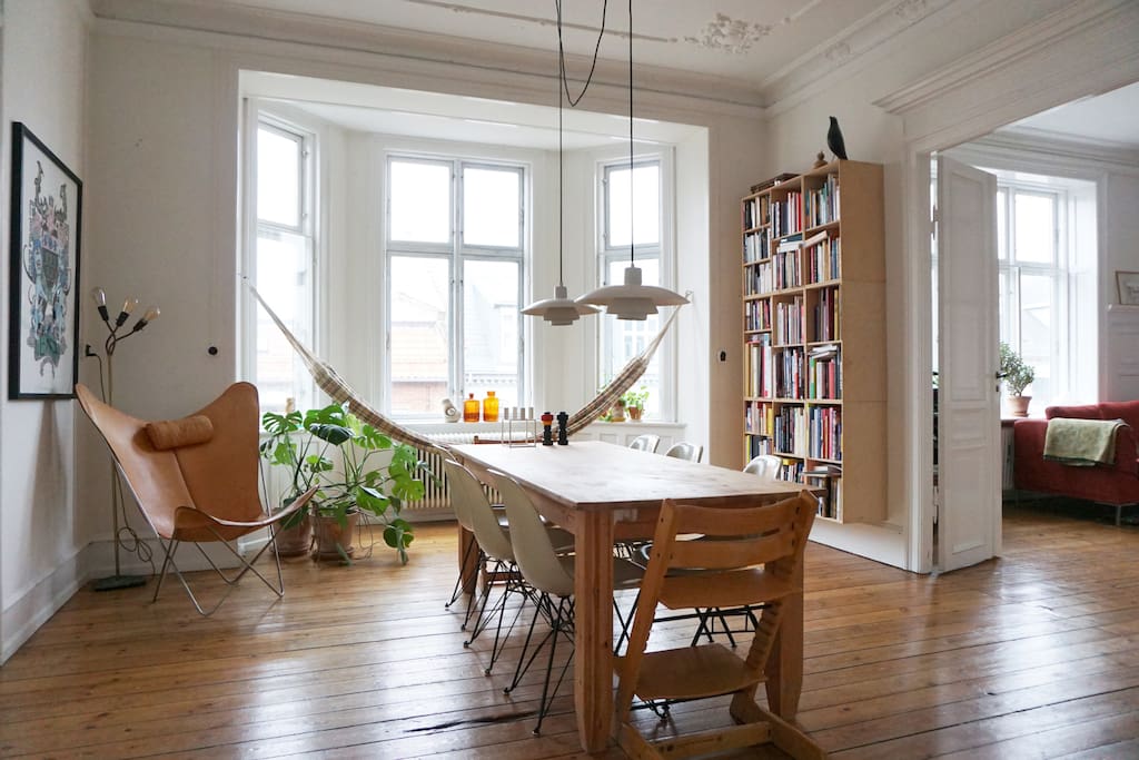 Dining room with large table. Two children high-chairs and six dining room chairs.
