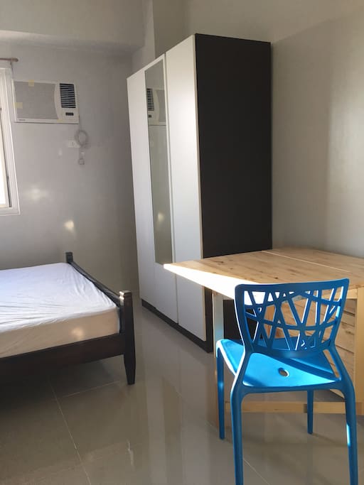 Air conditioning is available. Table for eating and studying, comes with two chairs.