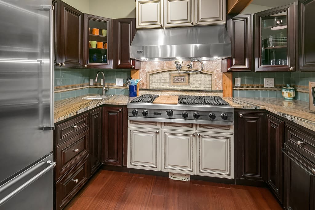 Viking appliances, two ovens, water spout to fill pots and gas burners.