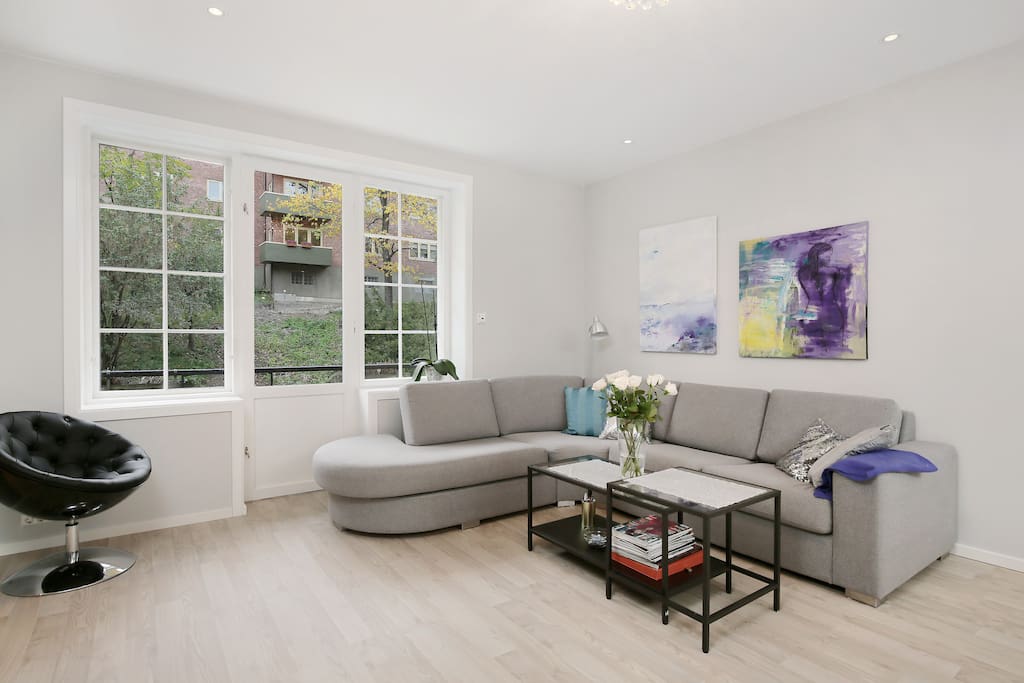 Large living-room with large windows and access to balcony with sun