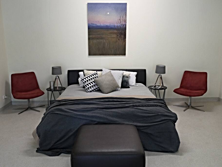 Spacious bedroom with king size bed