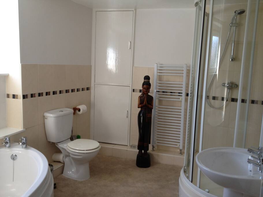 Large family bathroom - corner bath and double shower