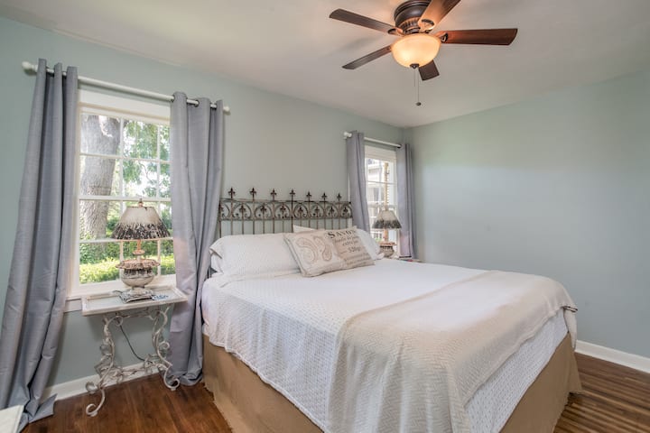 2nd bedroom features a Iron gate headboard on a King bed