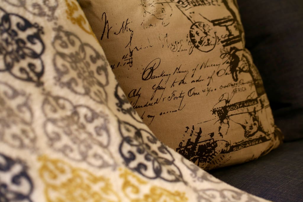 Couch with a throw and vintage-look pillows