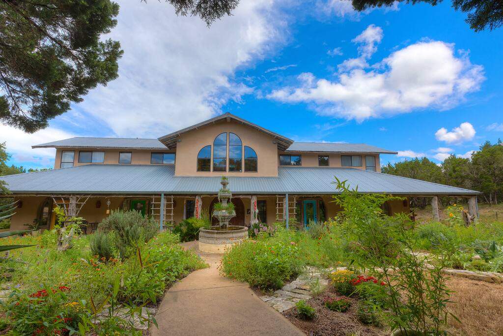 The home sits on 5 acres of deer-fenced Texas hill country