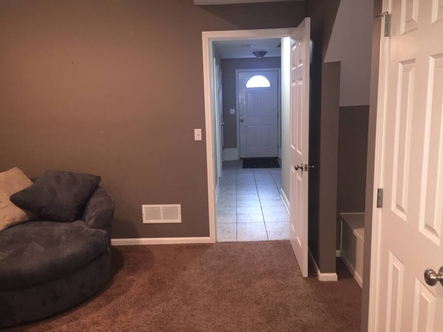 Hallway entrance from front door leading to private living room, and separate bedroom.