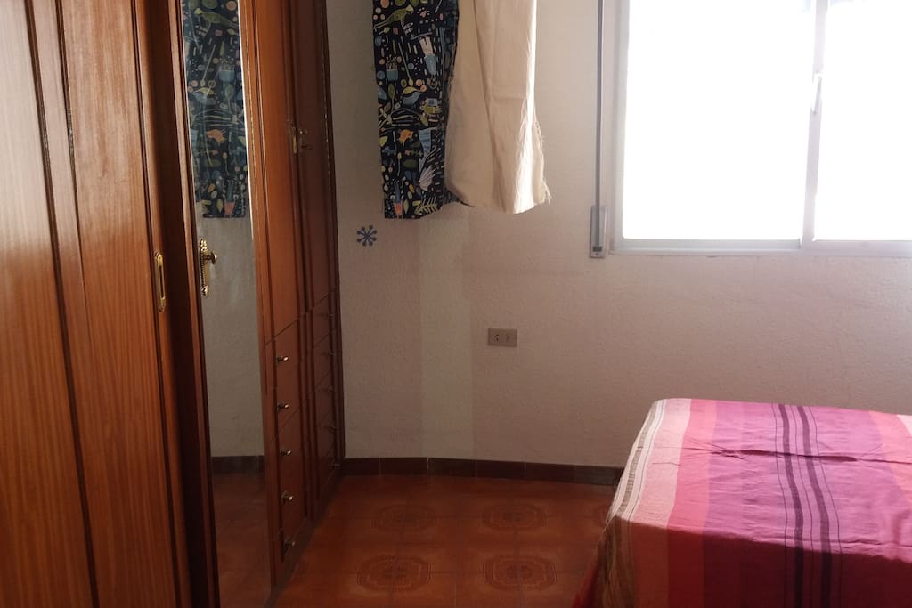 The room includes a big closet with a mirror.