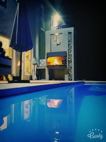 Family home in a forest setting.