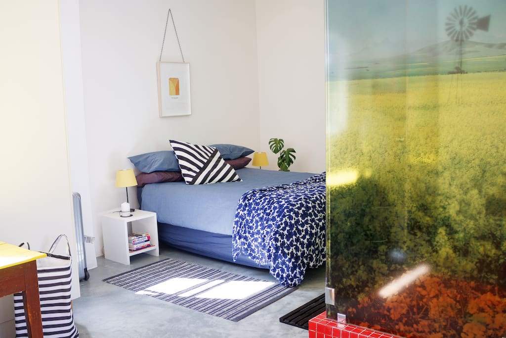 The bachelor-pad bedroom is spacious enough for two people to comfortably sleep and move around.