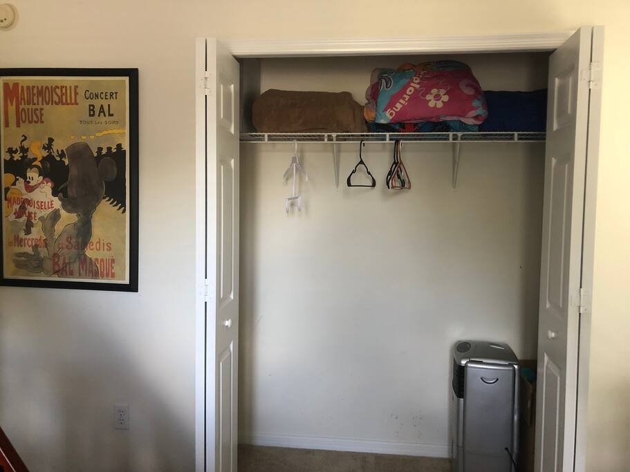 Bedroom closet with extra blankets and hangers if needed.