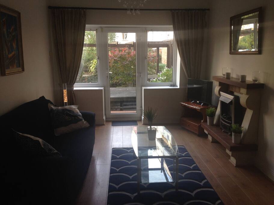Newly decorated living room with access to enclosed gardens
