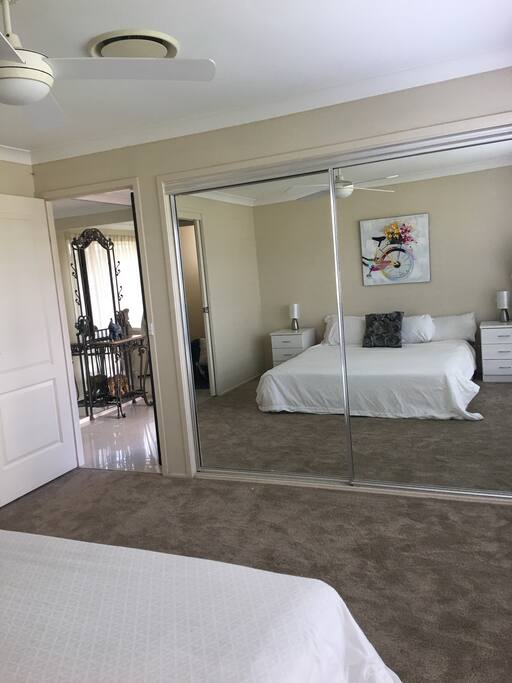 Front bedroom with mirrored wardrobe it also has a sliding door to the 3way bathroom