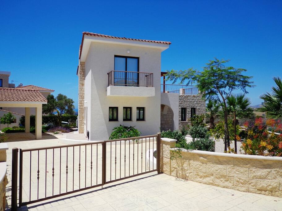 Parking area and rear of villa