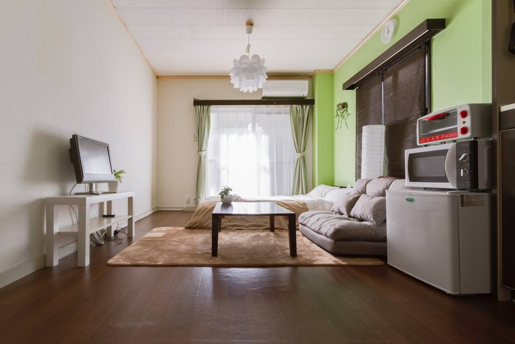Compact and tidy room equipped with semi double bed and sofa bed