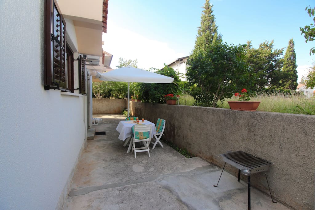 Terrace with sitting space and portable barbecue