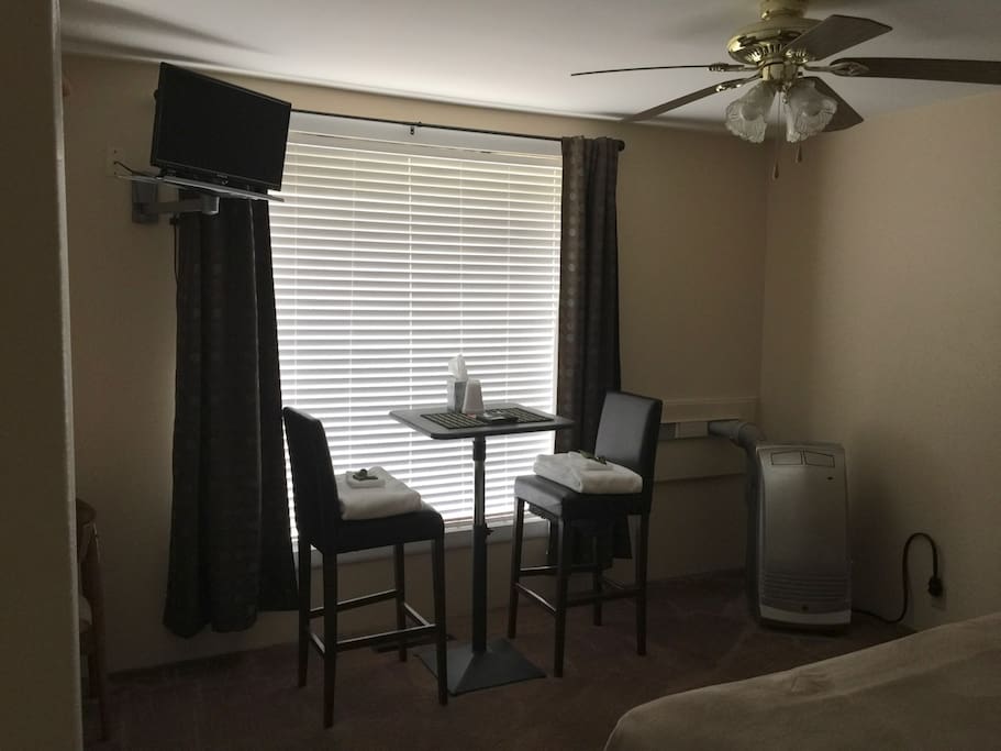 Work or in-room dining table, there is also a small built in desk or make up area.