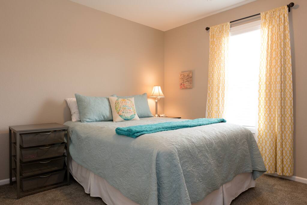 Private bedroom with queen size bed and closet.
