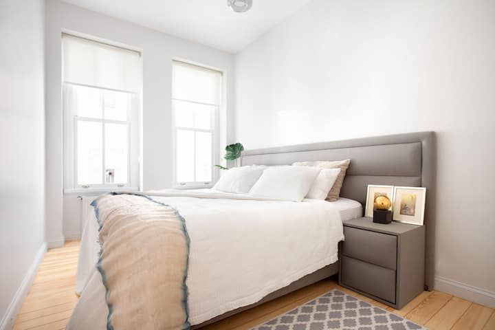 Bigger bedroom upstairs. There is a wardrobe not visible in the frame.