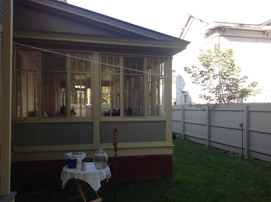 Side yard and three-season sun porch.