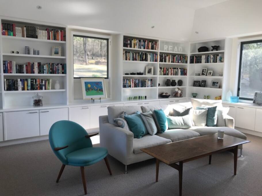 Library with a large selection of books and a TV