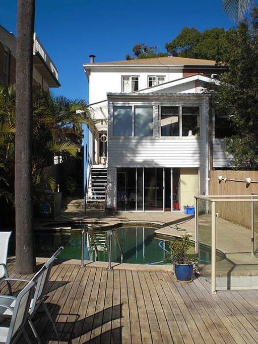 Back of terrace reveals the deck and pool